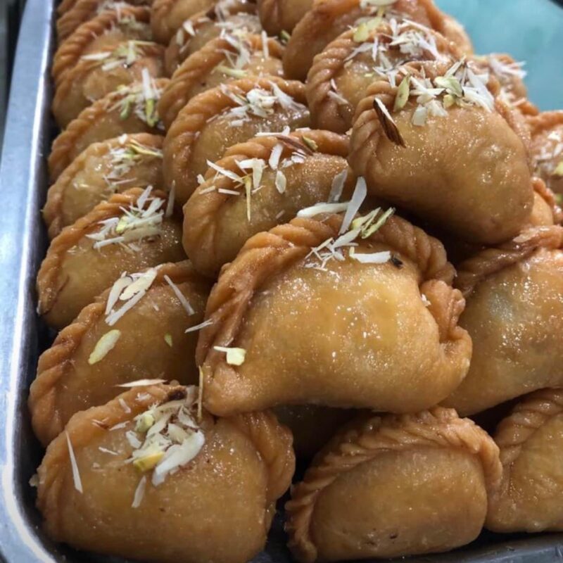 Glazed pastry filled with a burst of mixed nuts and traditional creamy milk paste (Khoya)
